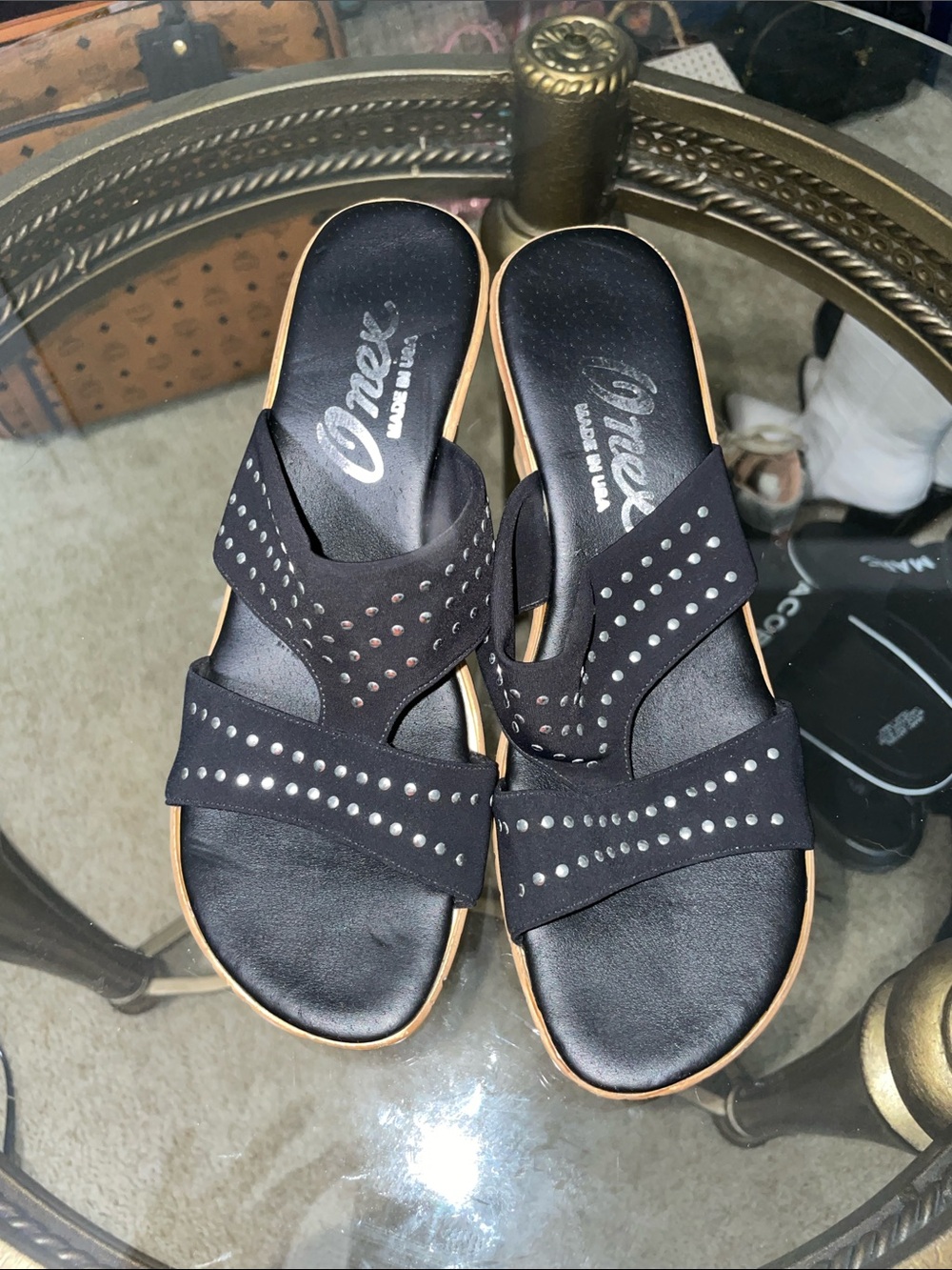 Onex Black Studded Slide Sandals with Tan bottoms.
